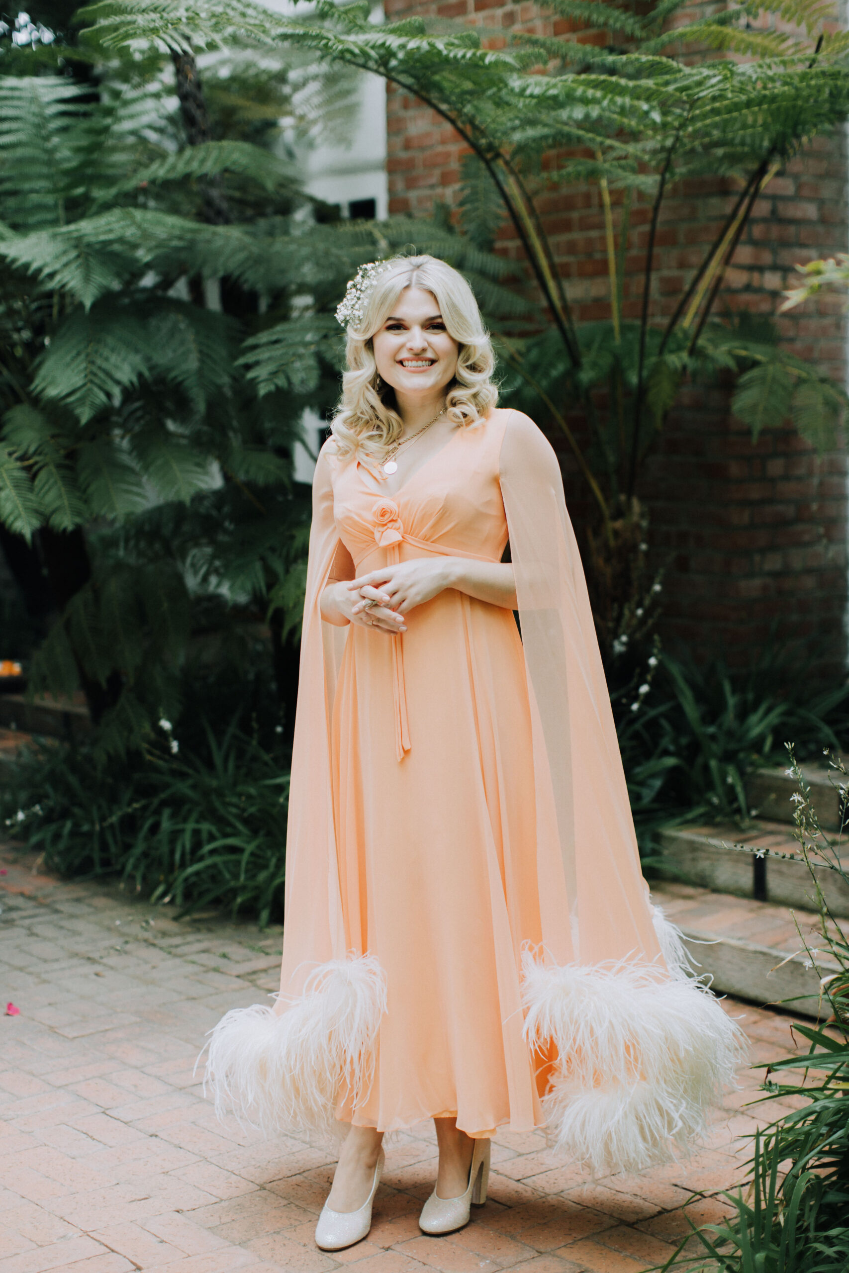 bridesmaid poses for a photo 