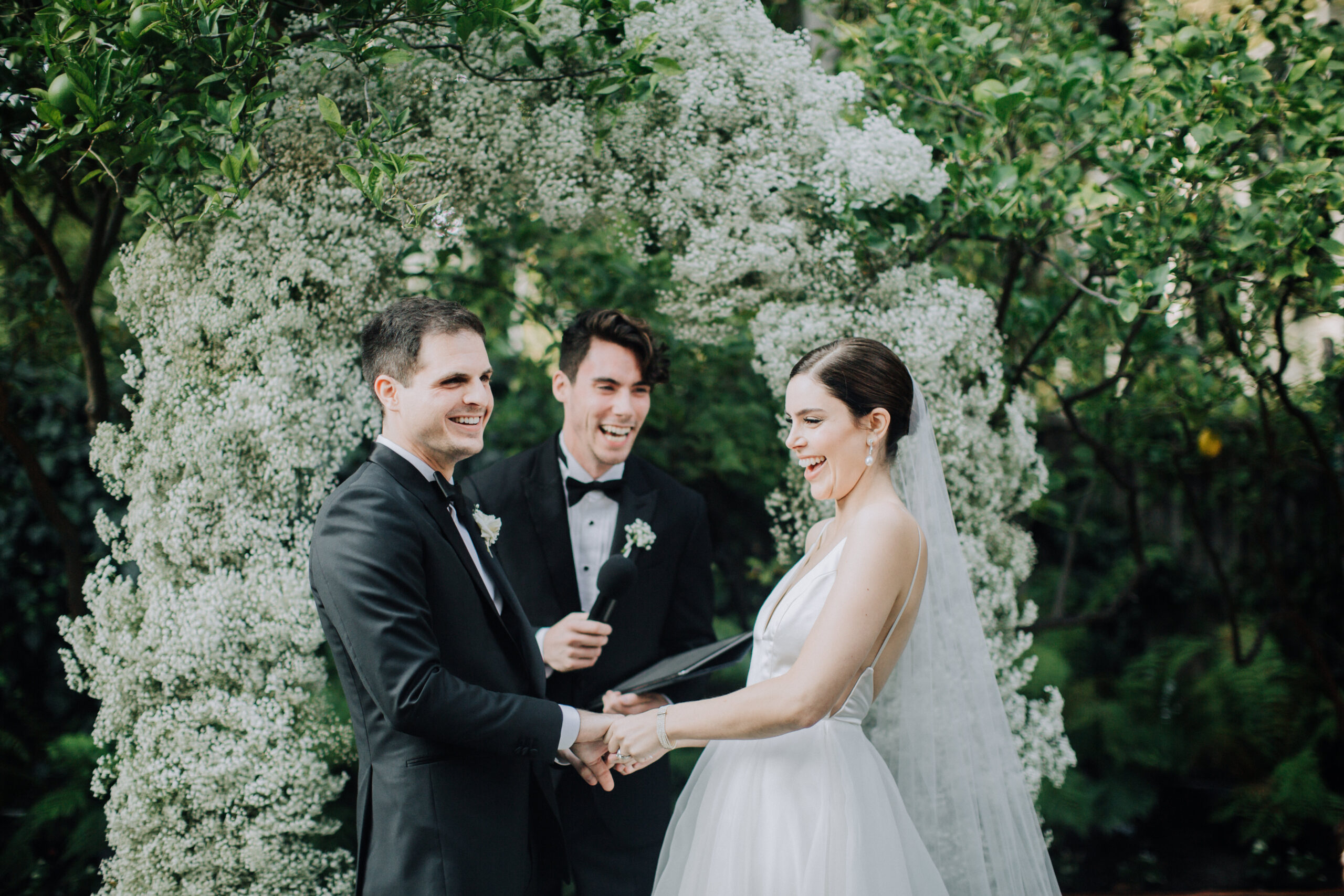 bride and groom share emotional moments during their elegant backyard garden wedding ceremony in Los Angeles