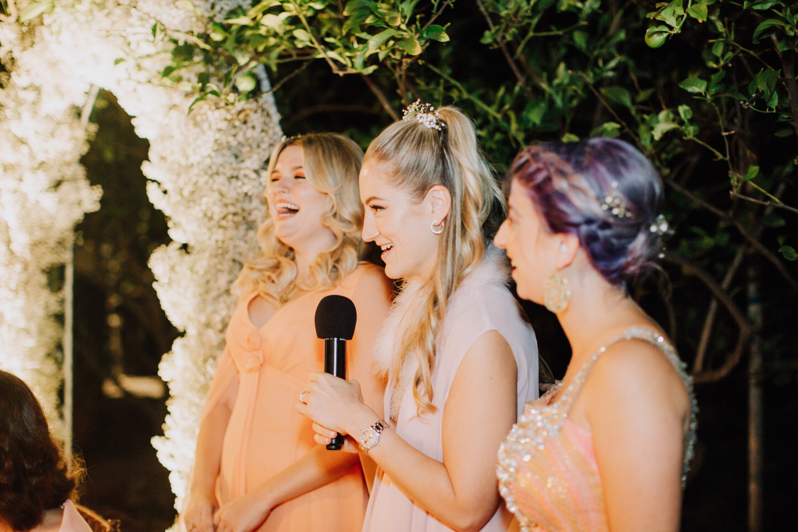 bridesmaid's give a speech during the dreamy garden wedding reception 