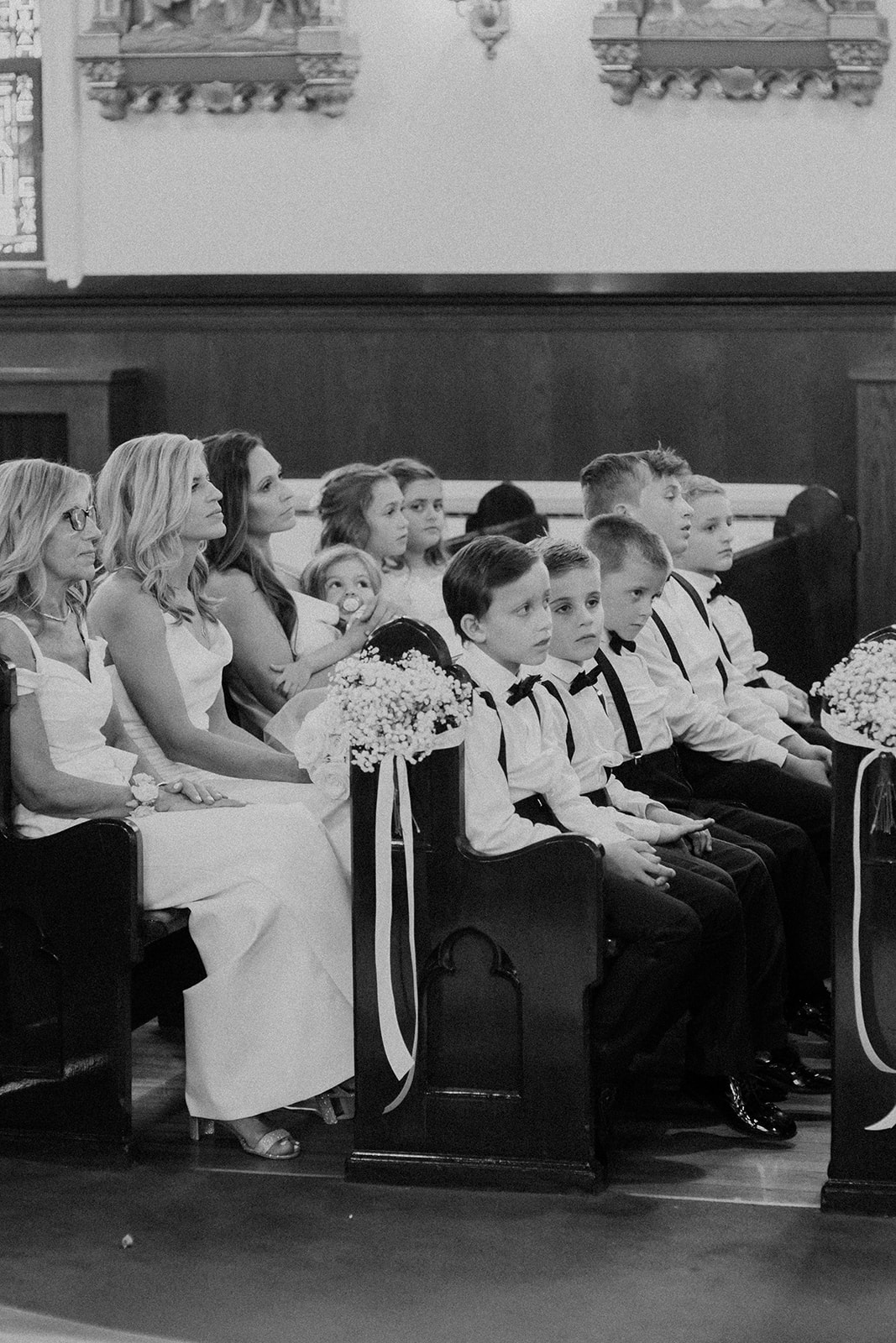 family looks on during the church wedding ceremony 