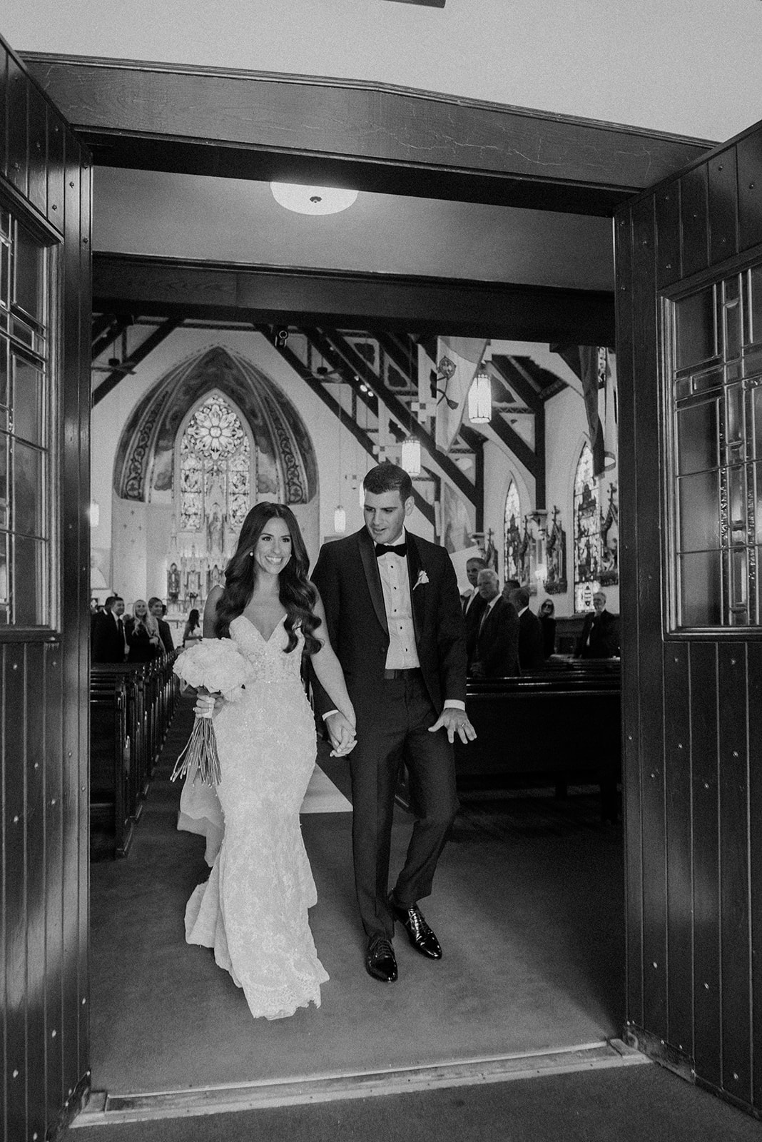 gorgeous bride and groom exit together after their vineyard wedding on long island