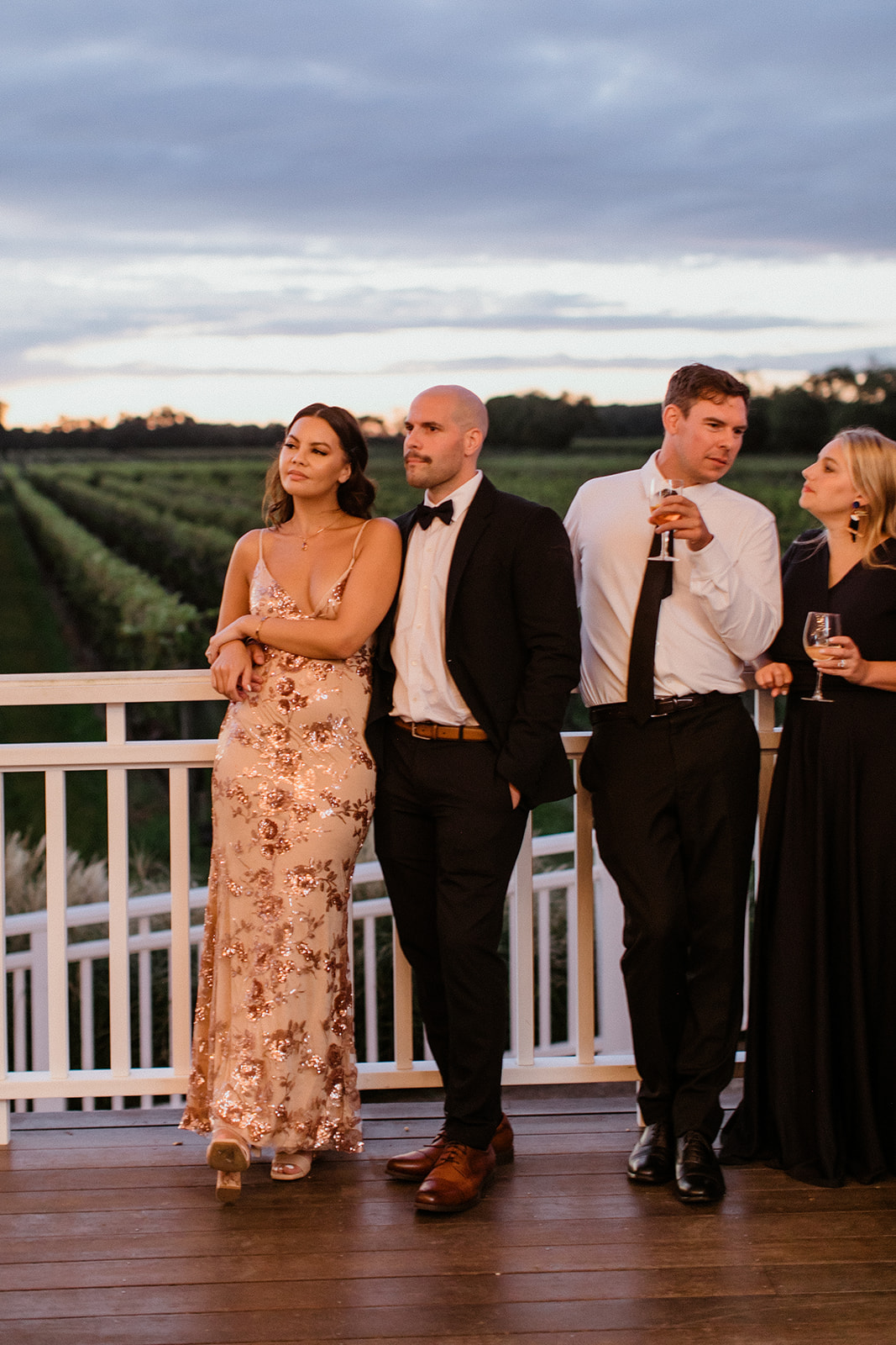 guests celebrate with the bride and groom during the elegant winery wedding reception