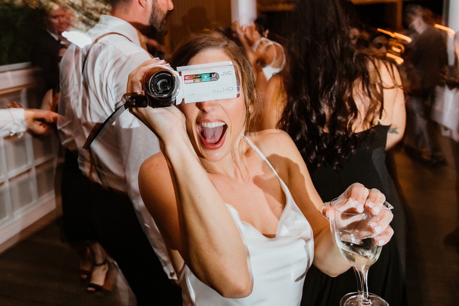 guests celebrate with the bride and groom during the elegant winery wedding reception