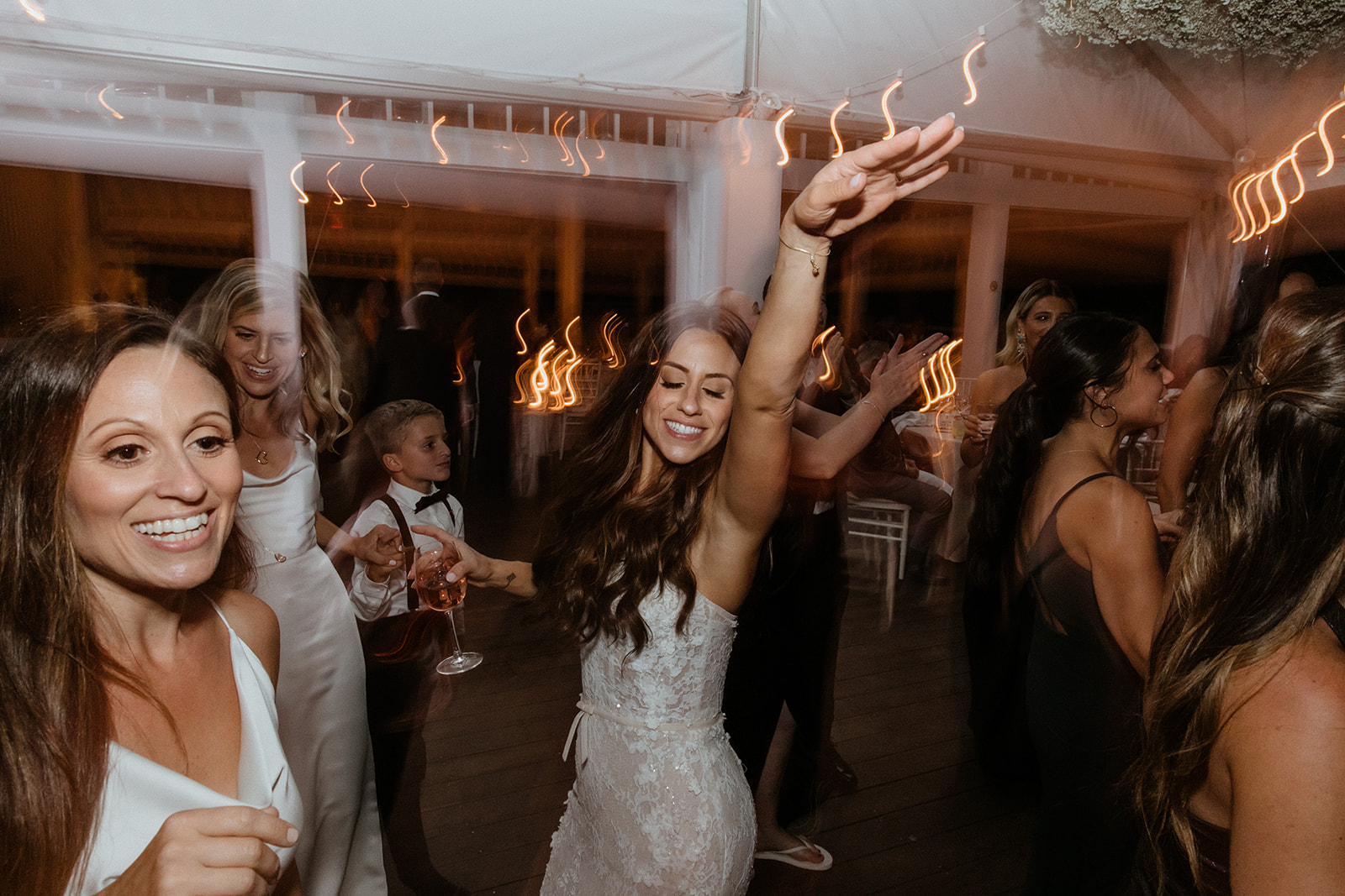 guests celebrate with the bride and groom during the elegant winery wedding reception