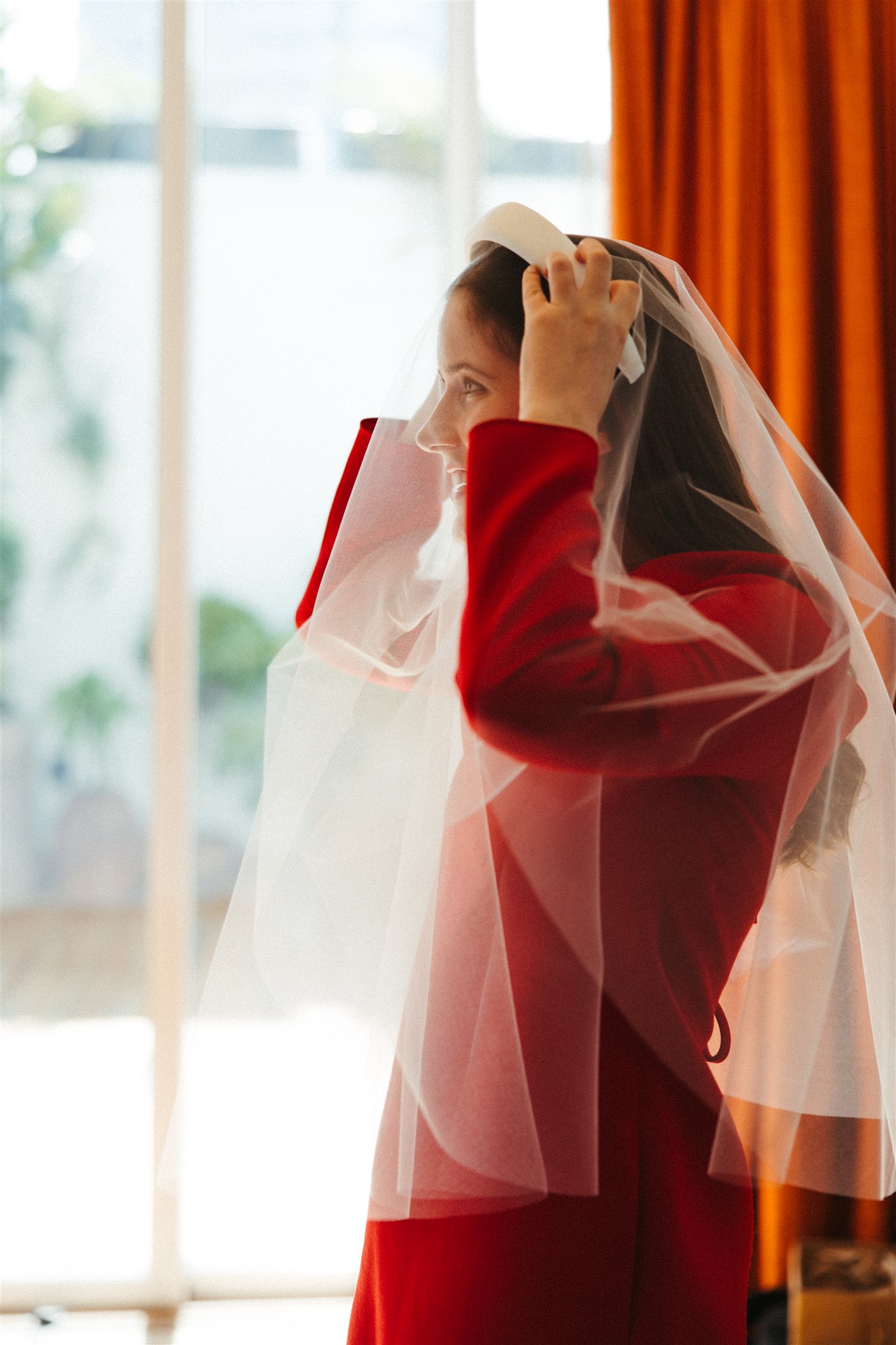 beautiful bride poses for a photo while she finalizes prep for her dreamy Mexico City elopement