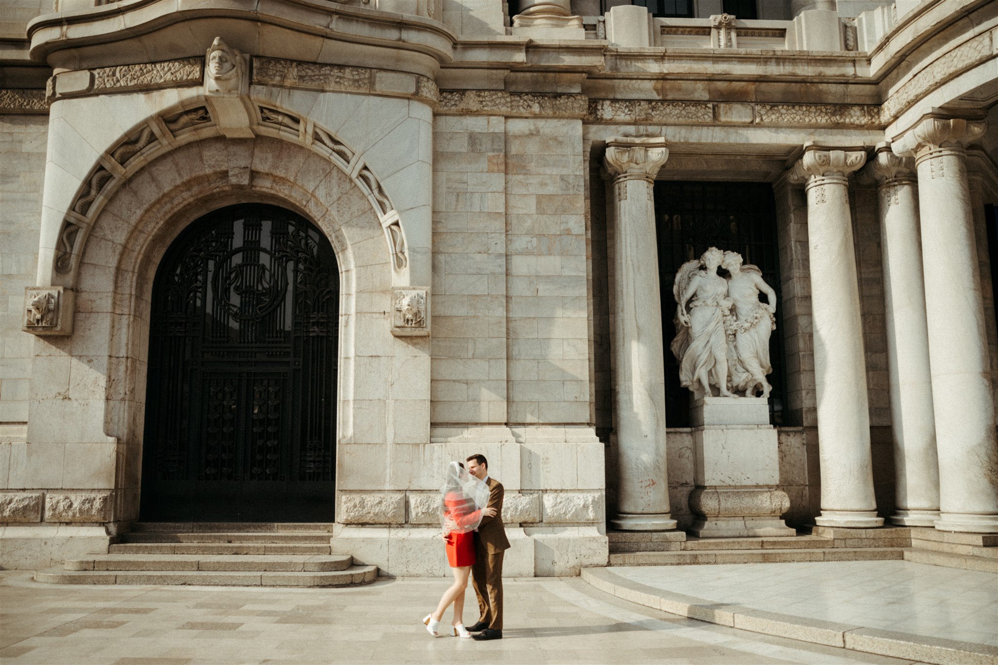 bride and groom walk the streets of Mexico City together after their dreamy elopement 