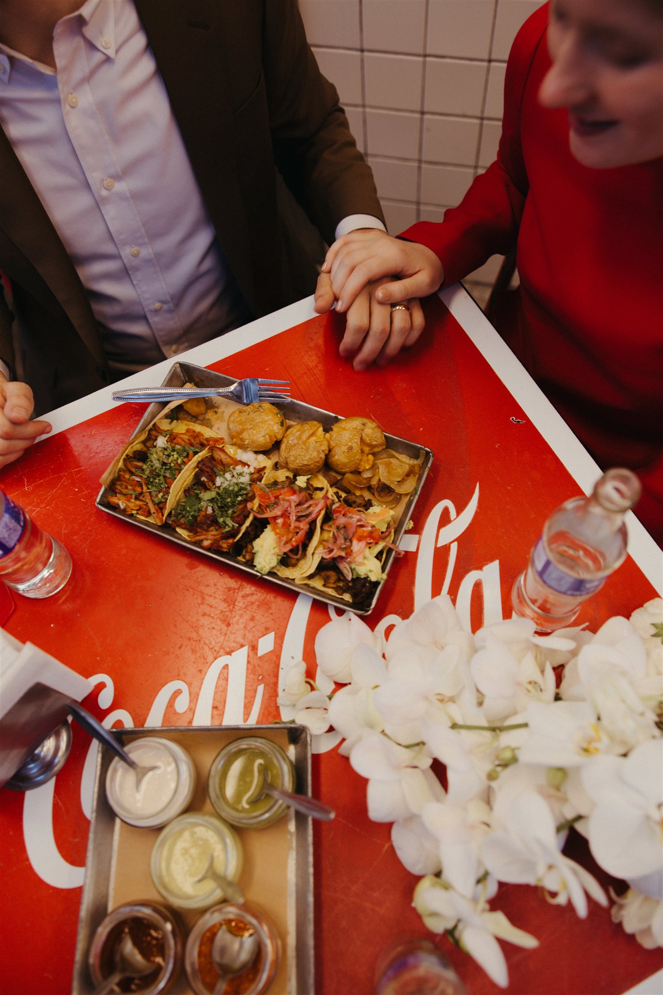 beautiful bride and groom share tacos and laughs