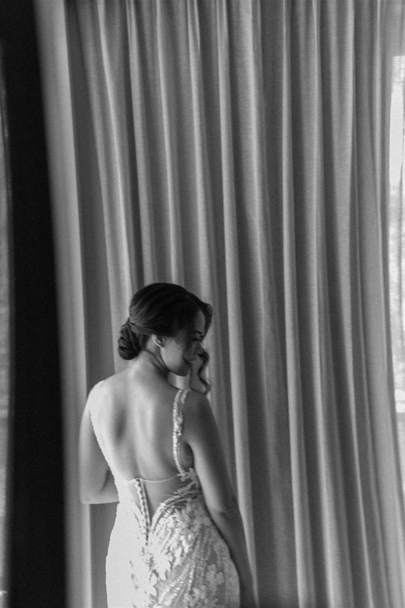 bride poses inside before her tropical wedding day