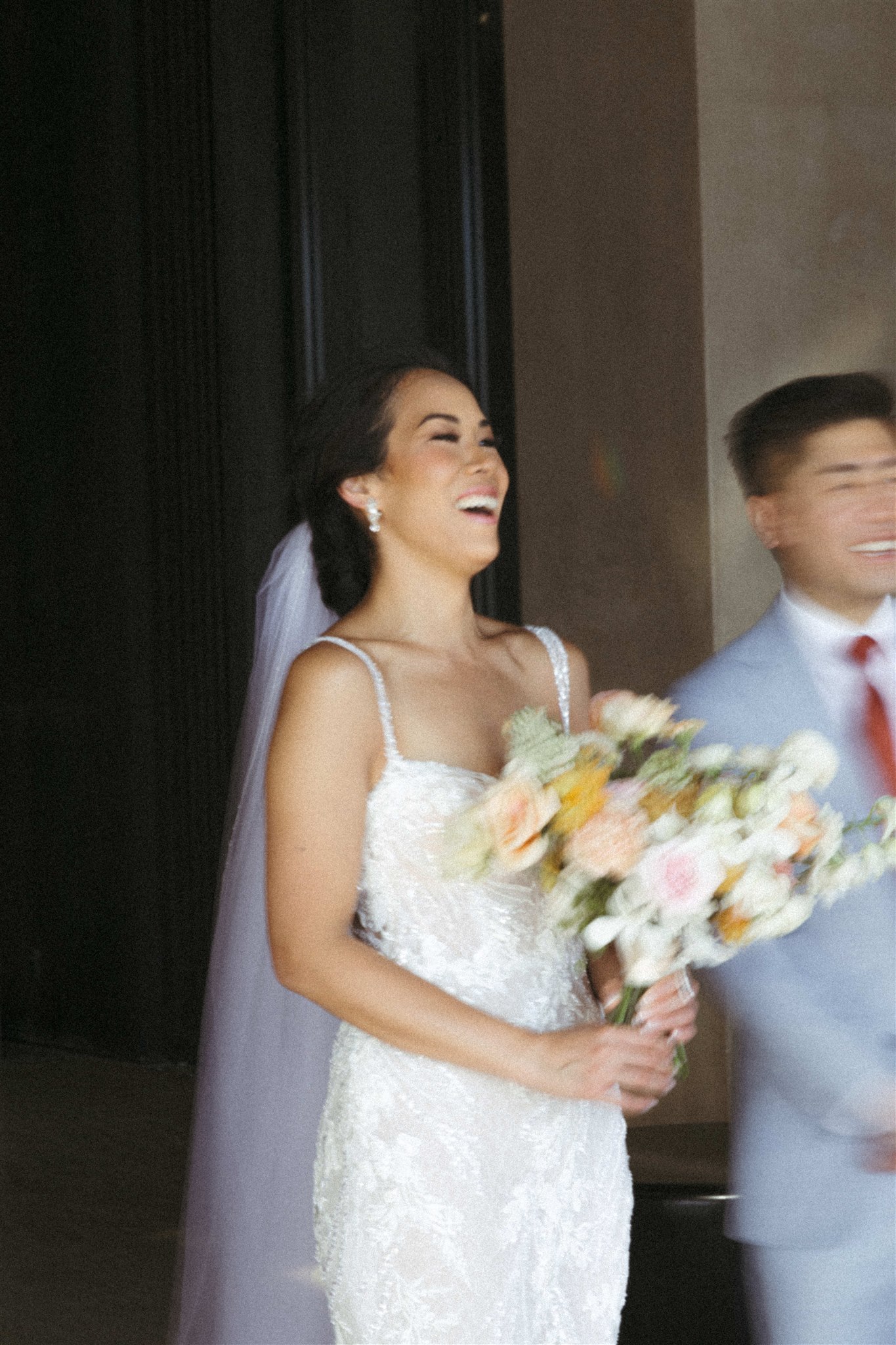 bride and groom pose together during their acre baja wedding day