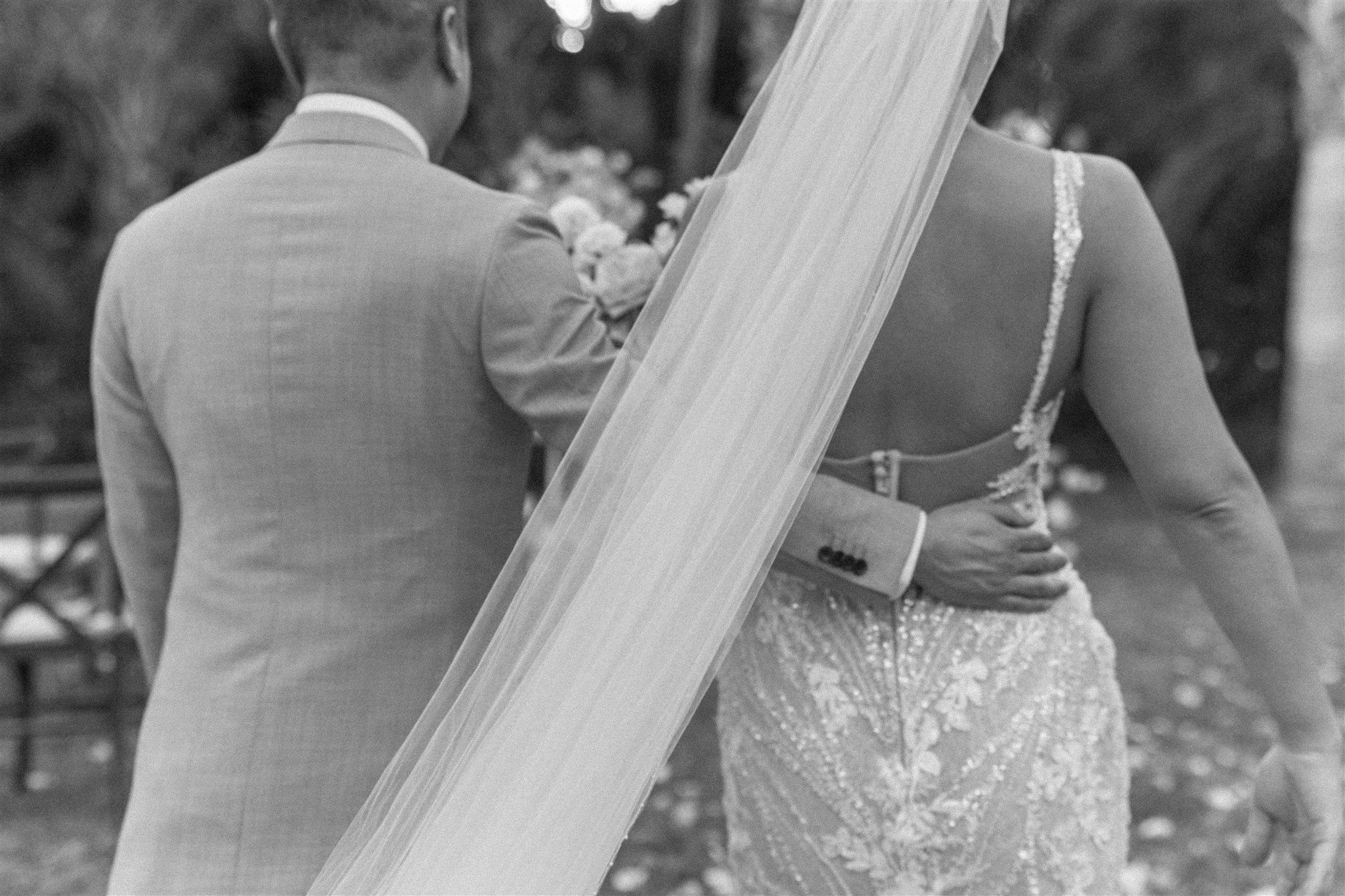 bride and groom pose together during their acre baja wedding day