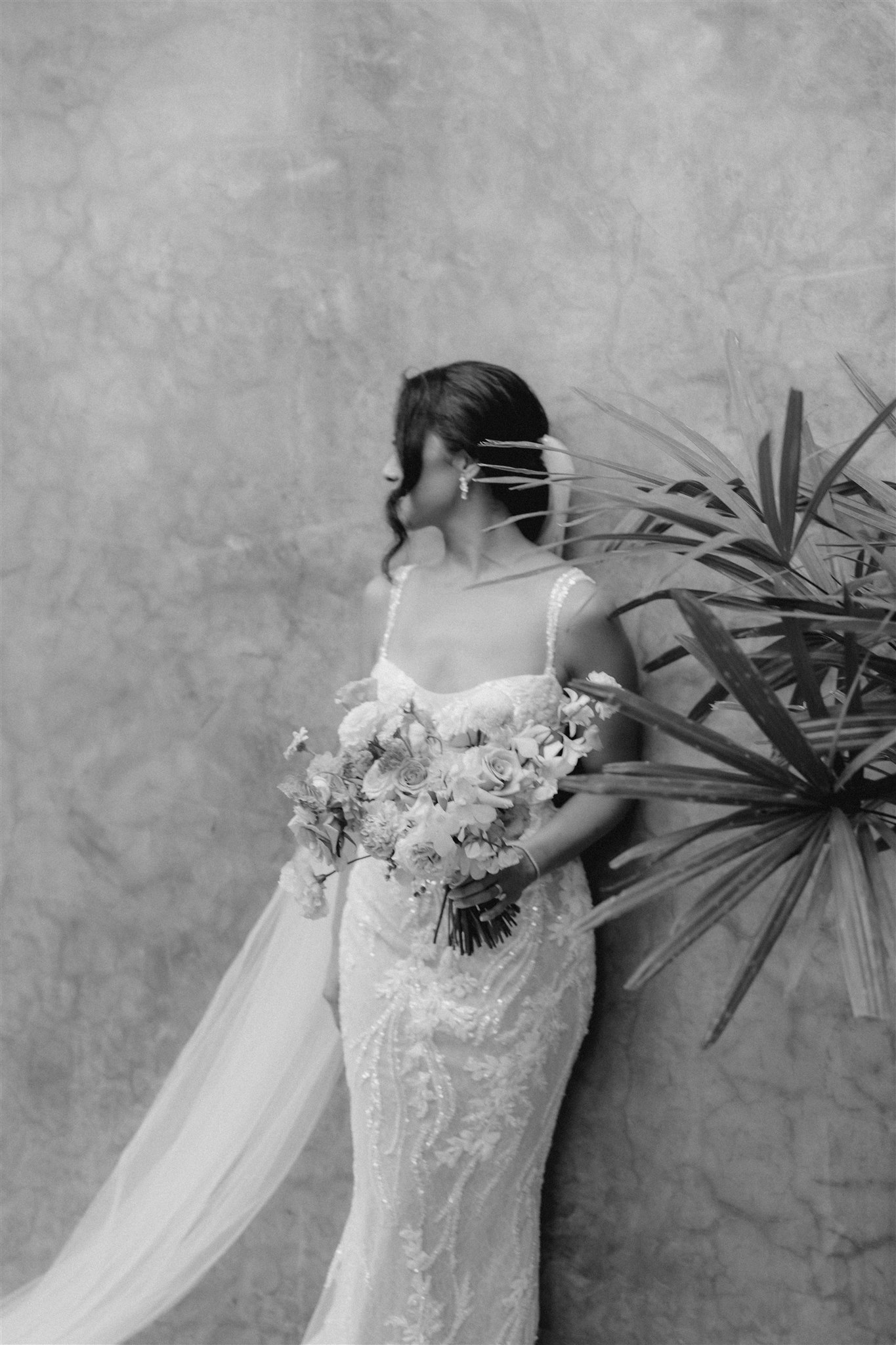 bride poses in the tropical acre baja wedding venue