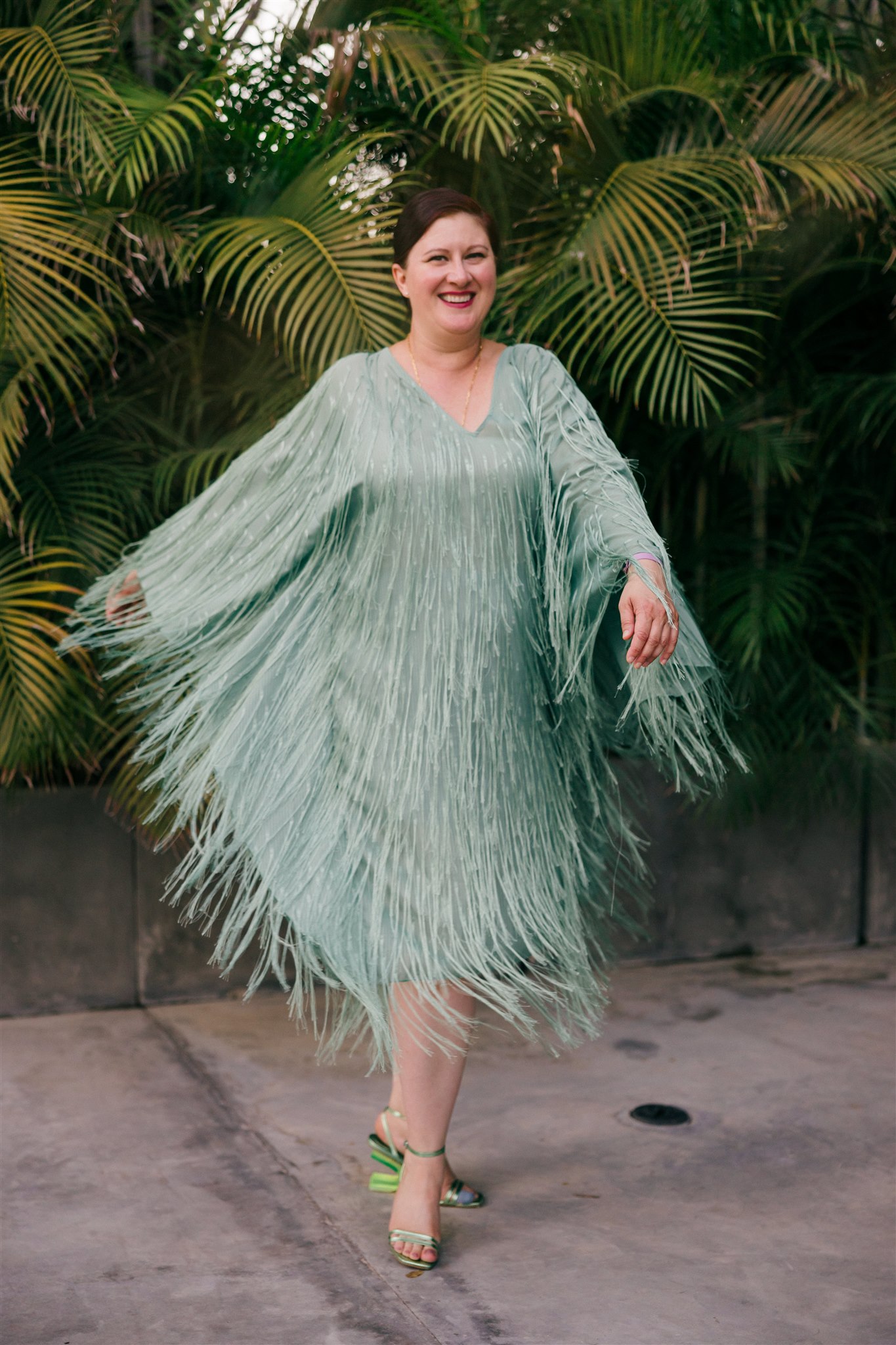 guest poses for a photo during the cocktail hour