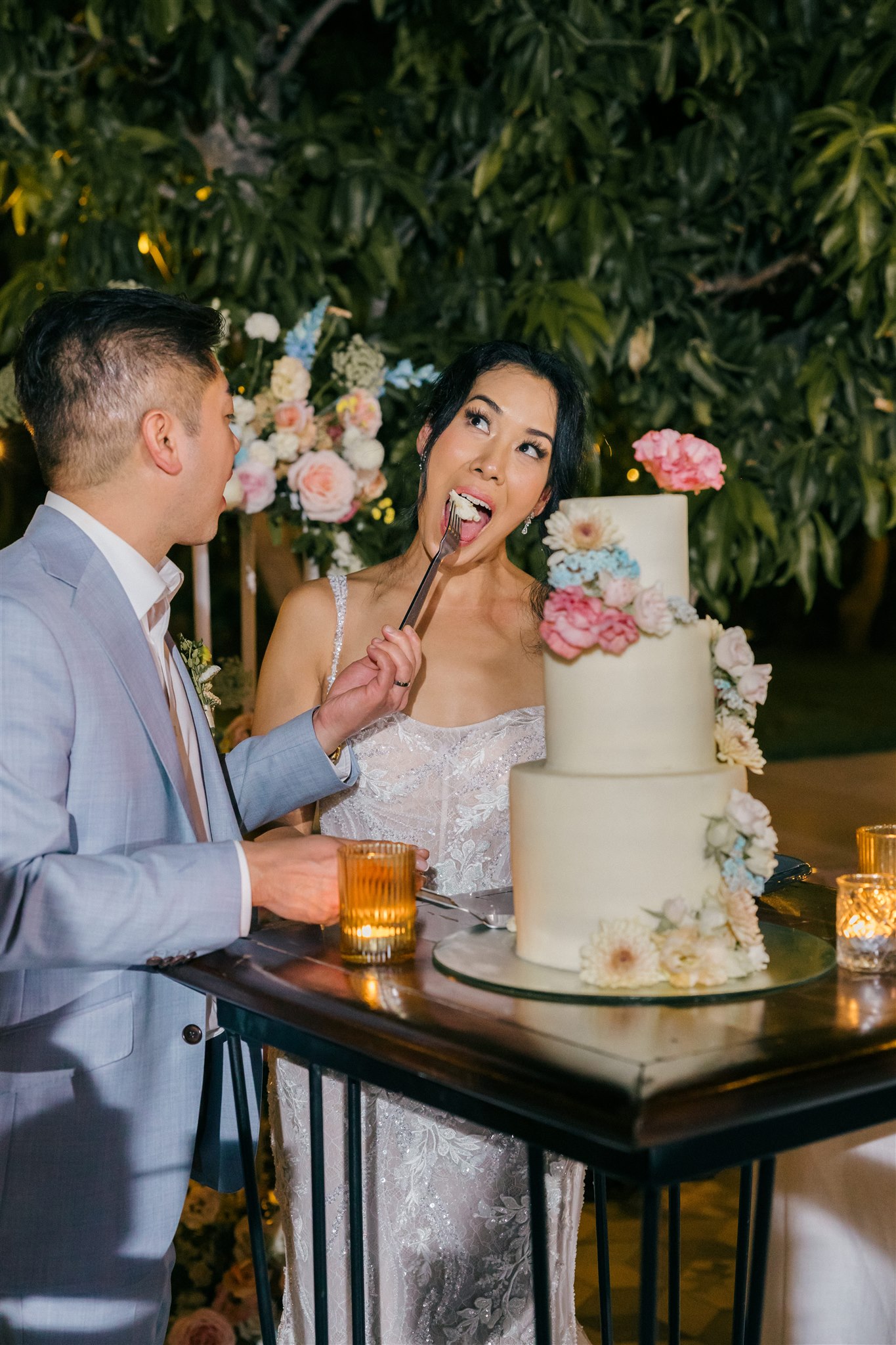 bride and groom share their wedding cake