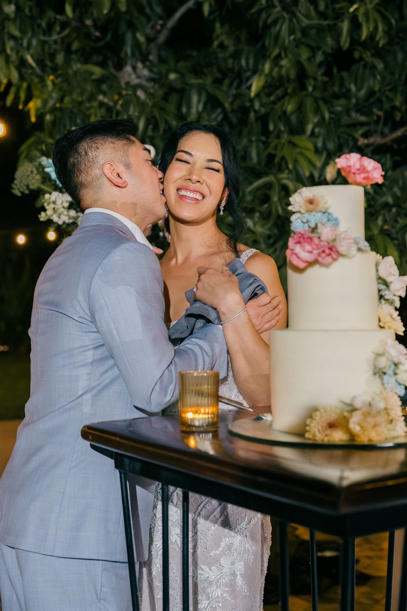 bride and groom share their wedding cake 