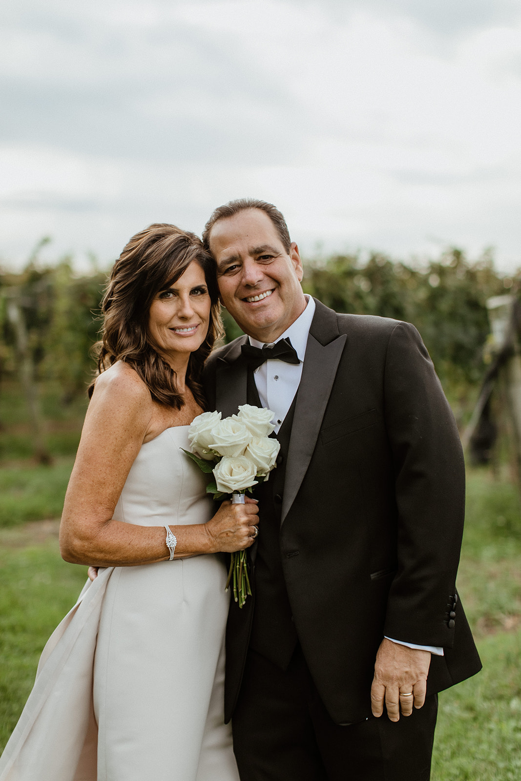 parents pose together after the dreamy New York winery wedding