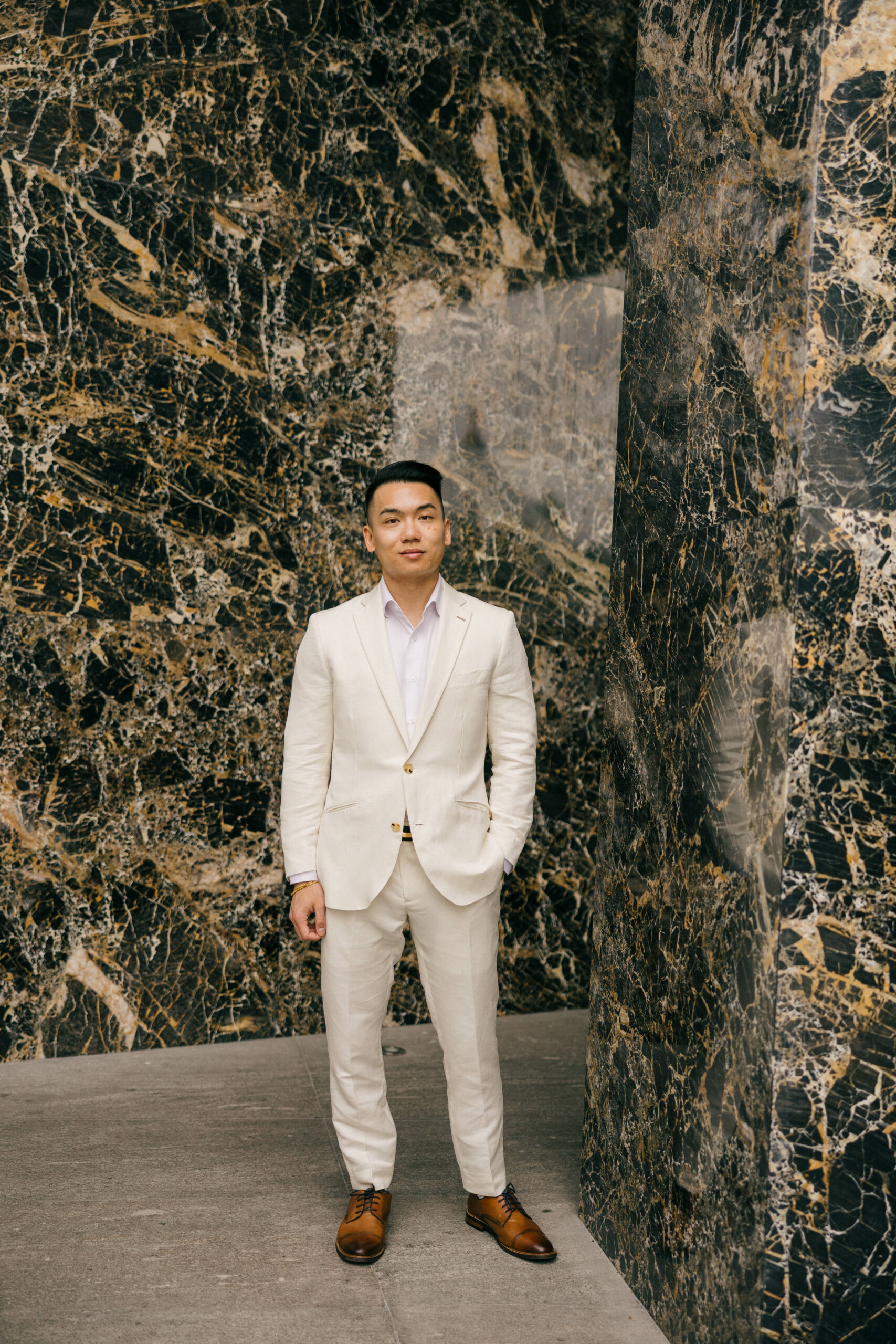 groom poses for a photo before his dreamy Cancun wedding day