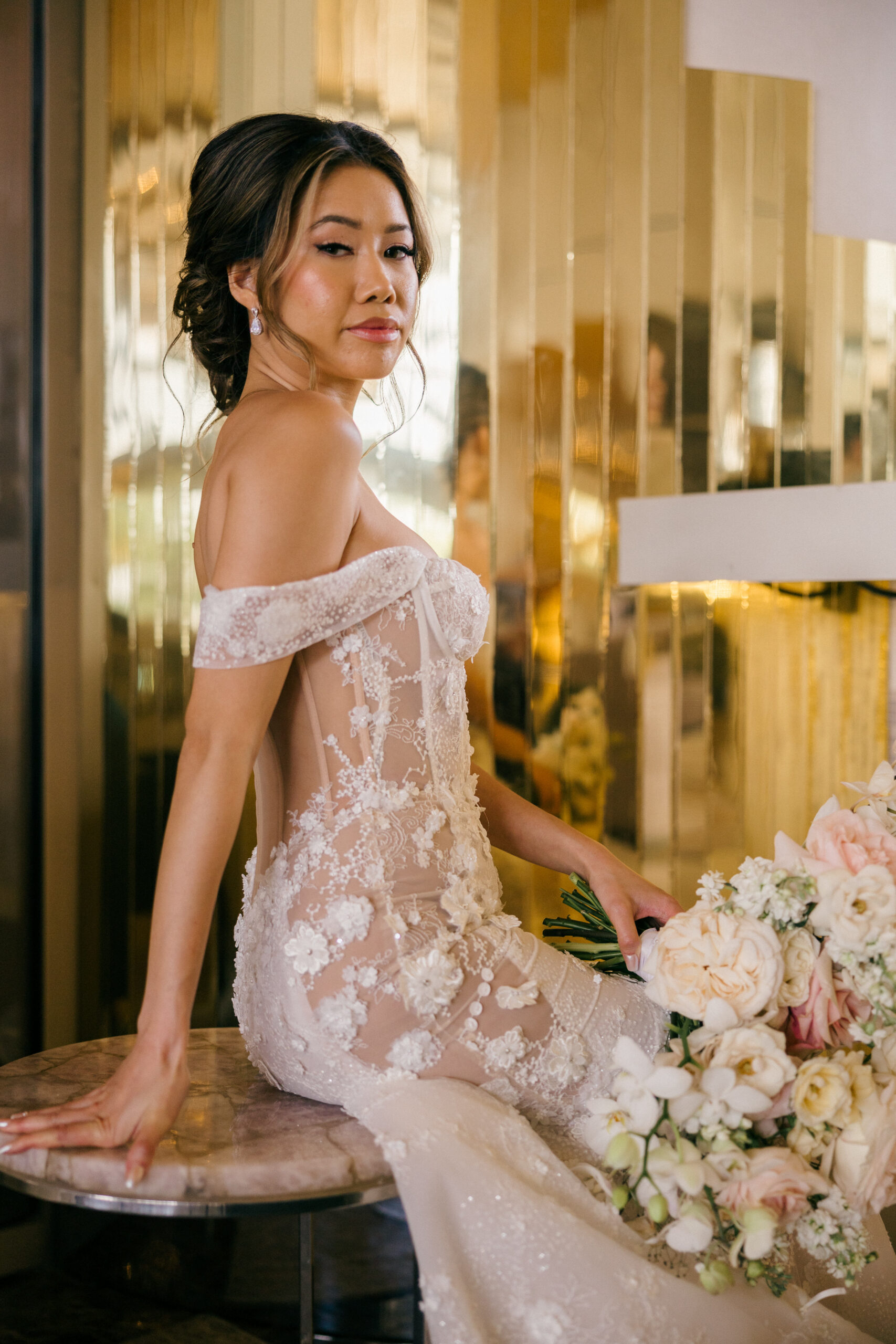 beautiful bride poses for a photo before her elegant Cancun wedding day