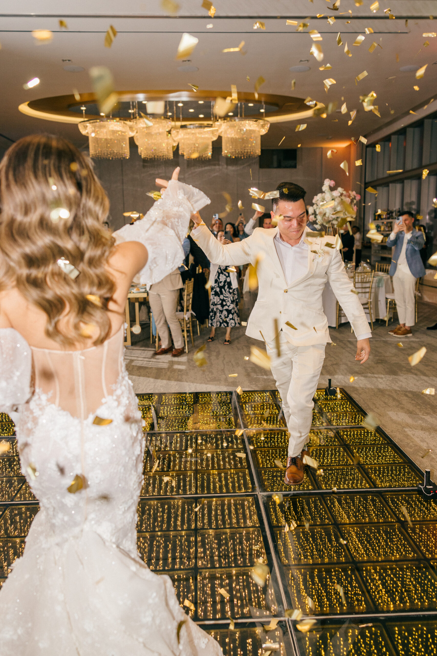 bride and groom celebrate on the dance floor