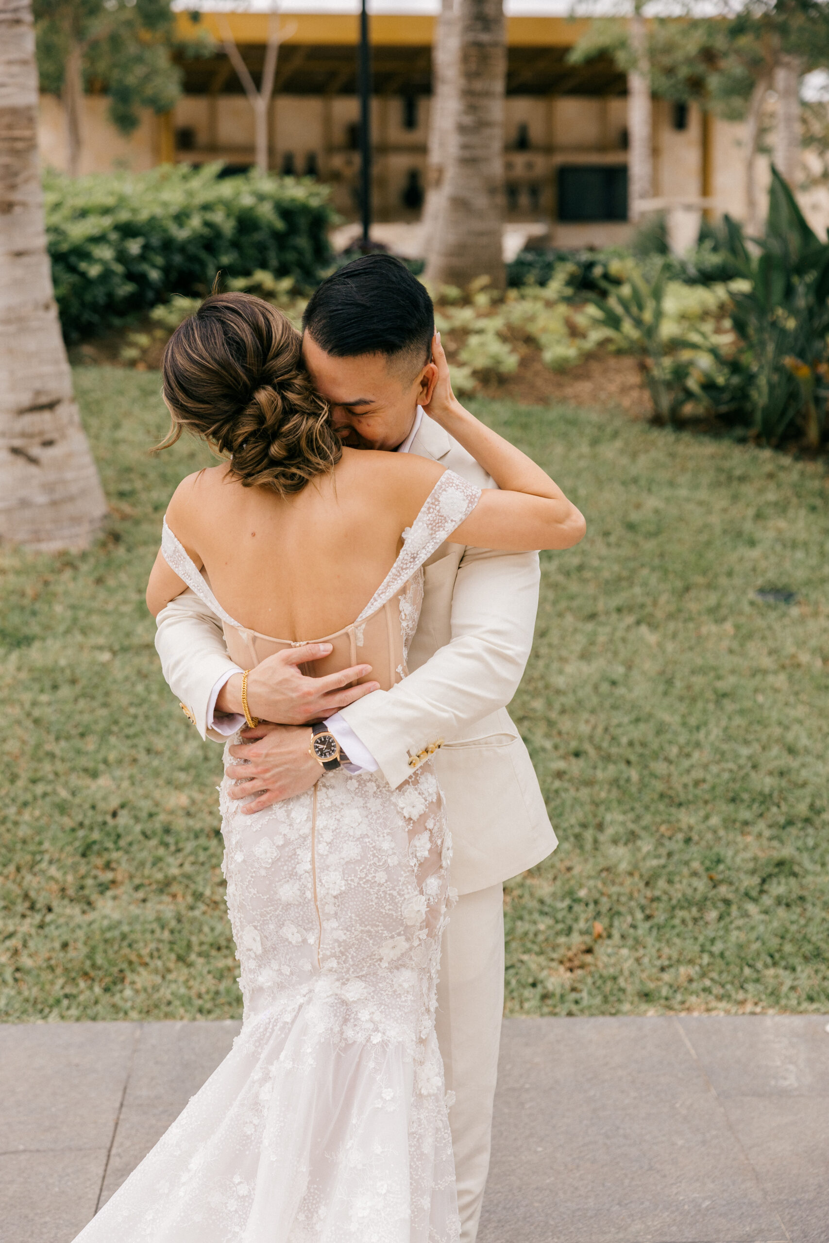 stunning bride and groom pose for a photo together before their cancun wedding day