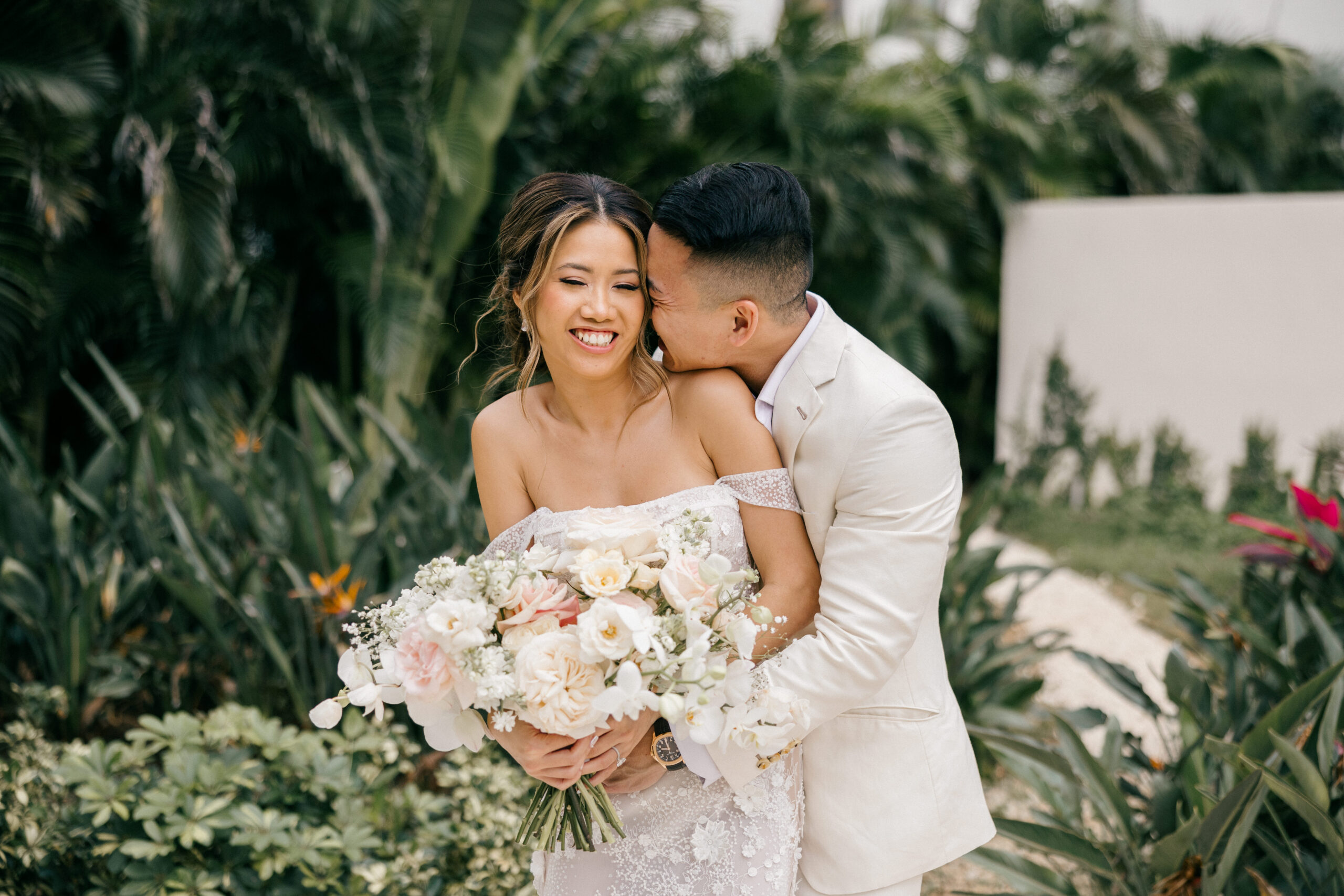 bride and groom pose together after their dreamy Cancun wedding