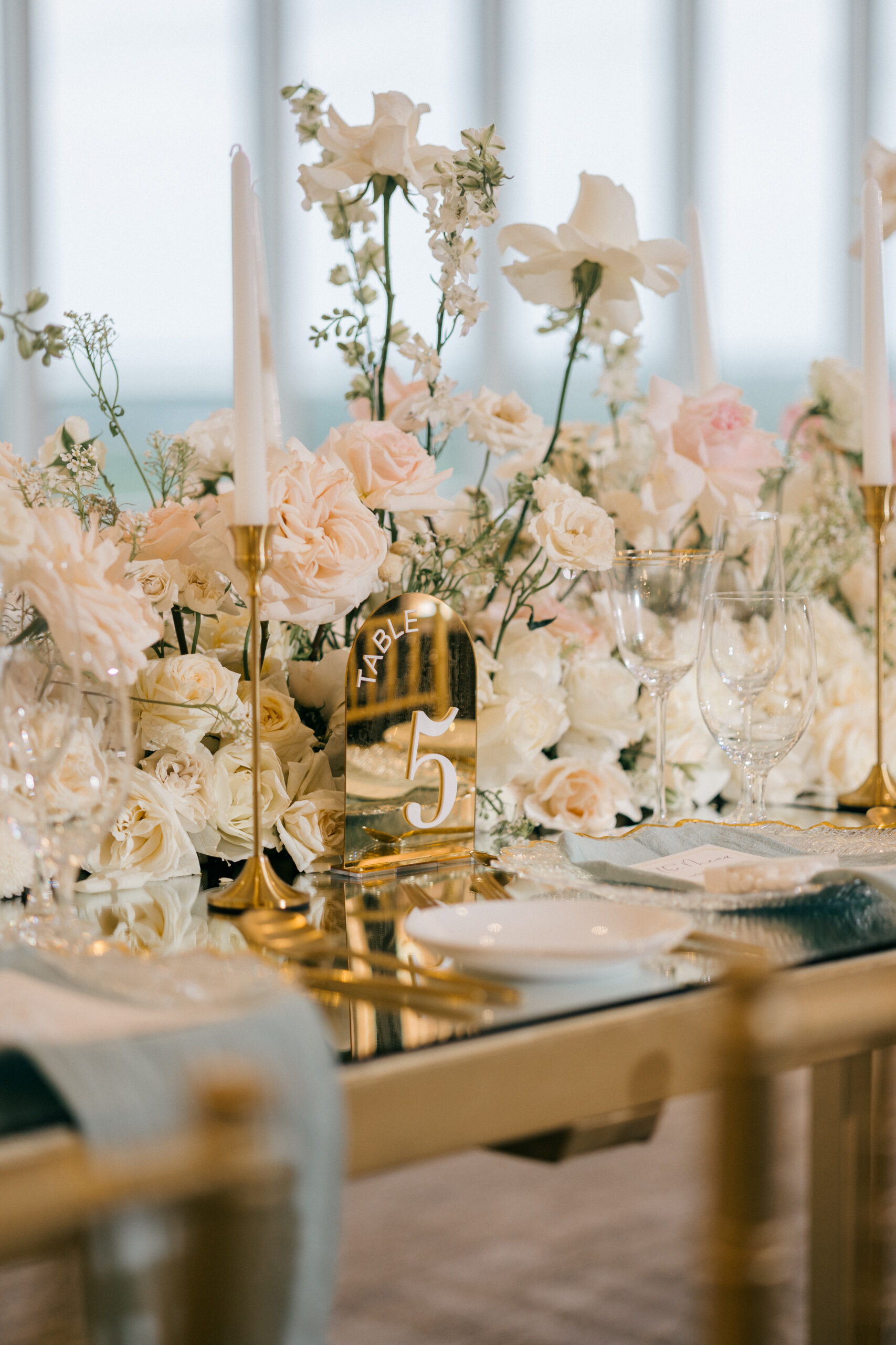 elegant white wedding florals with gold hardware wedding reception decor 