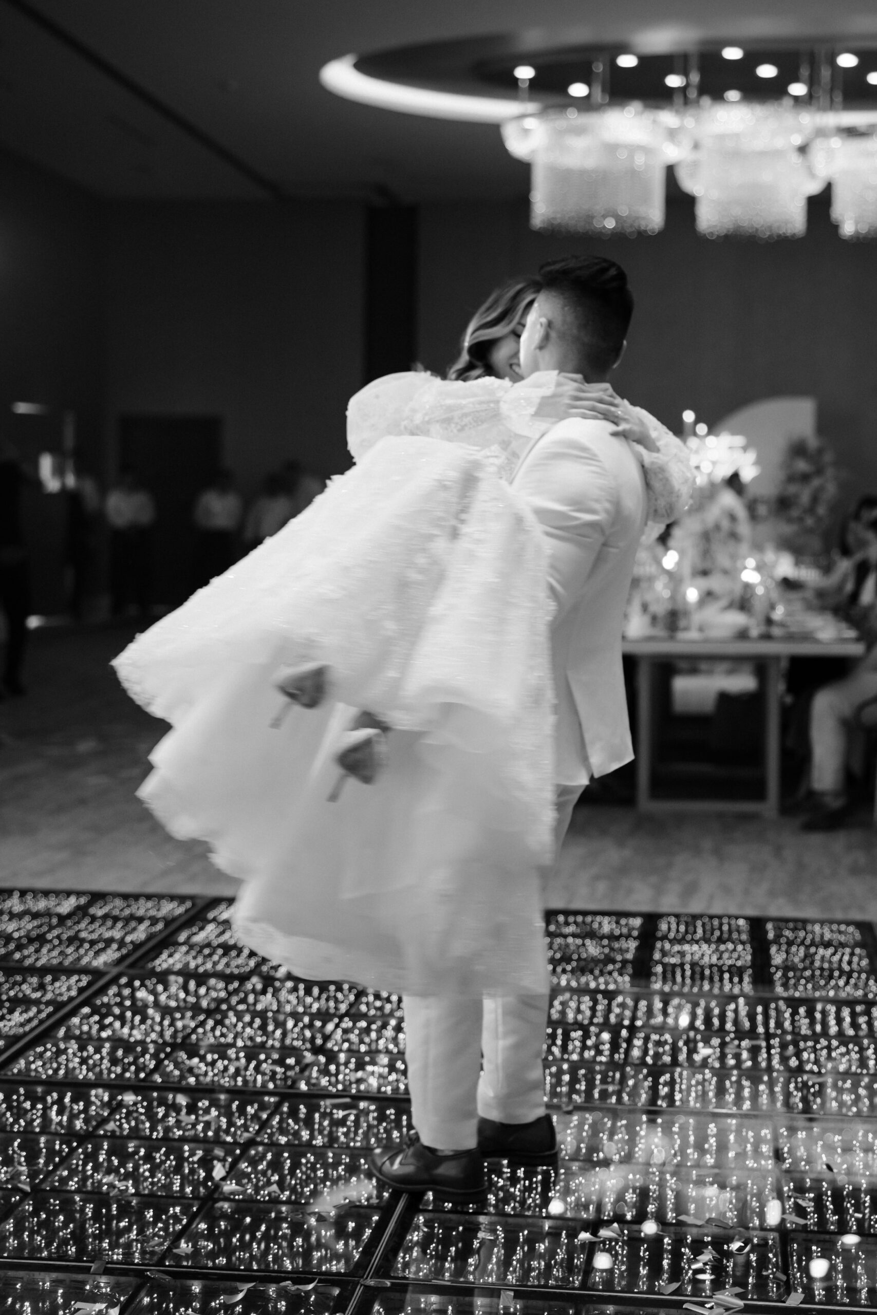 bride and groom celebrate on the dance floor