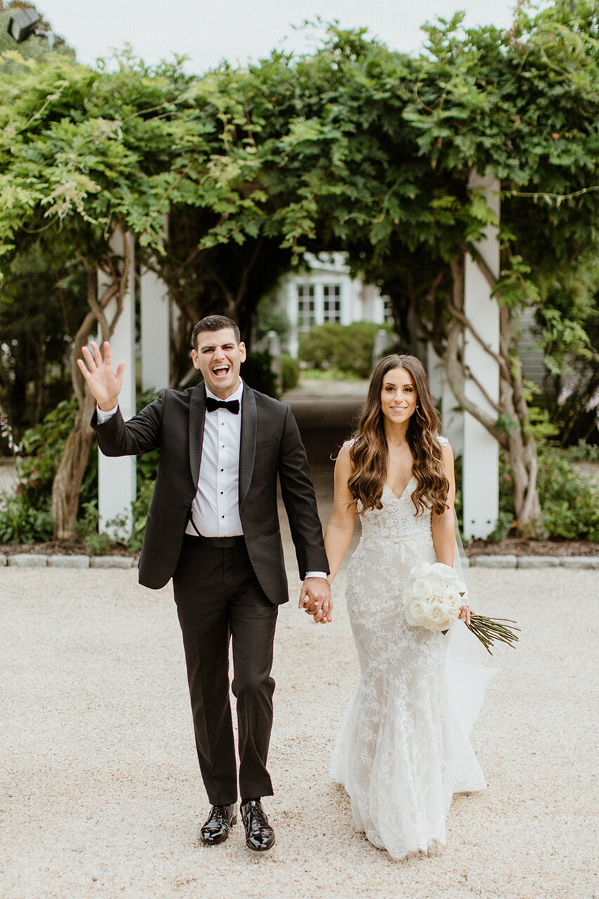 gorgeous bride and groom pose together after their vineyard wedding on long island