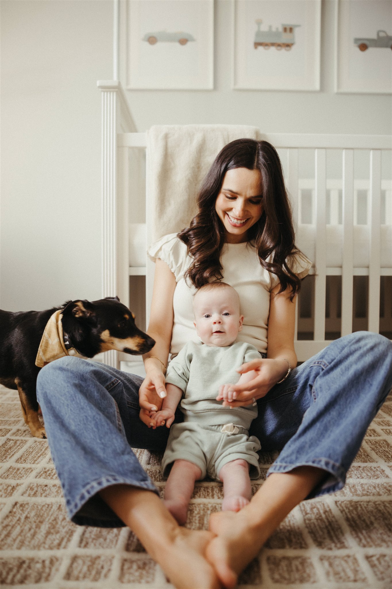 new mom poses with her newborn during their in-home newborn sessions