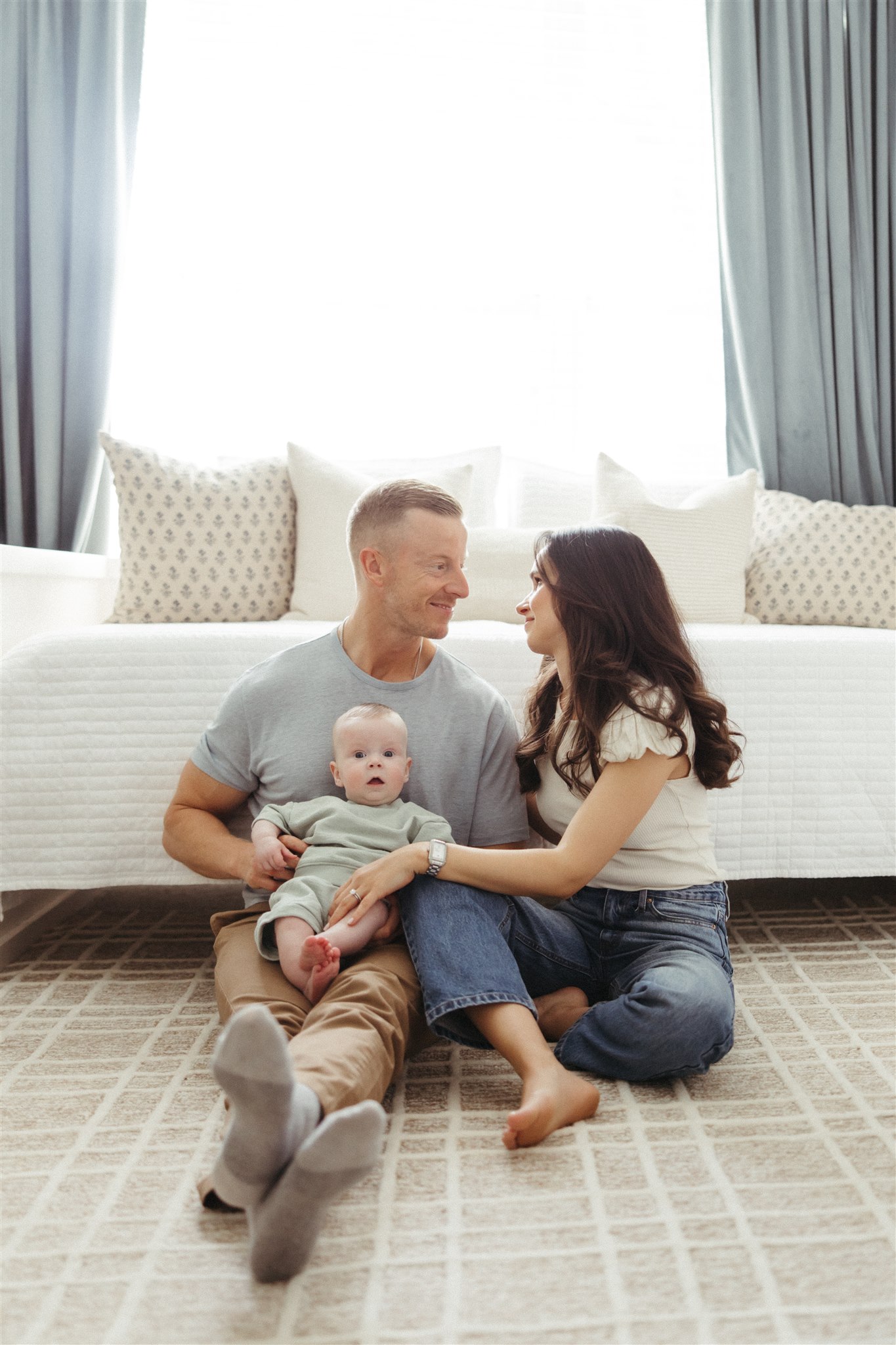 family poses during their in-home newborn sessions