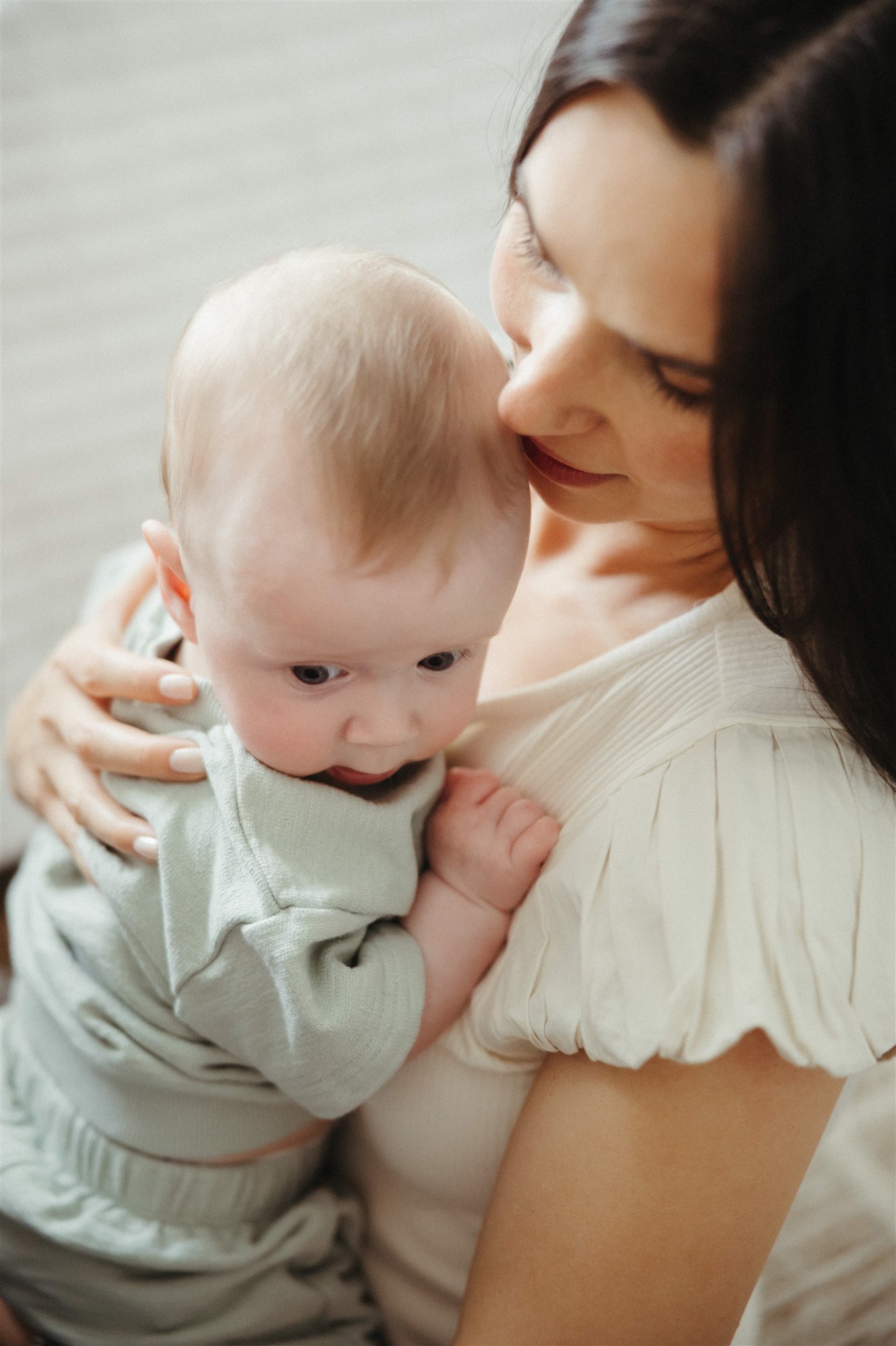 mom poses with her newborn 