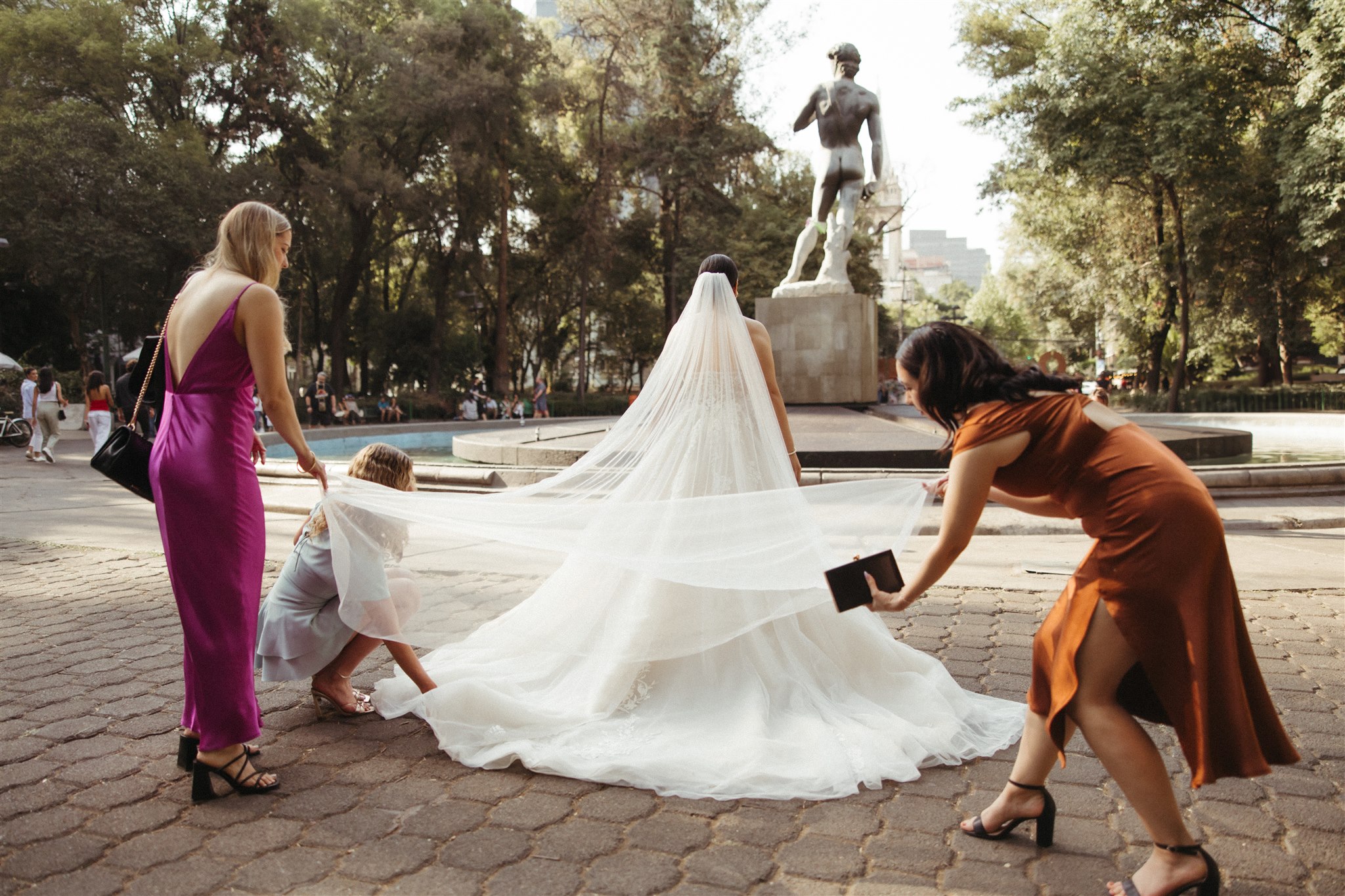 bride poses with a photo with her bridesmaids