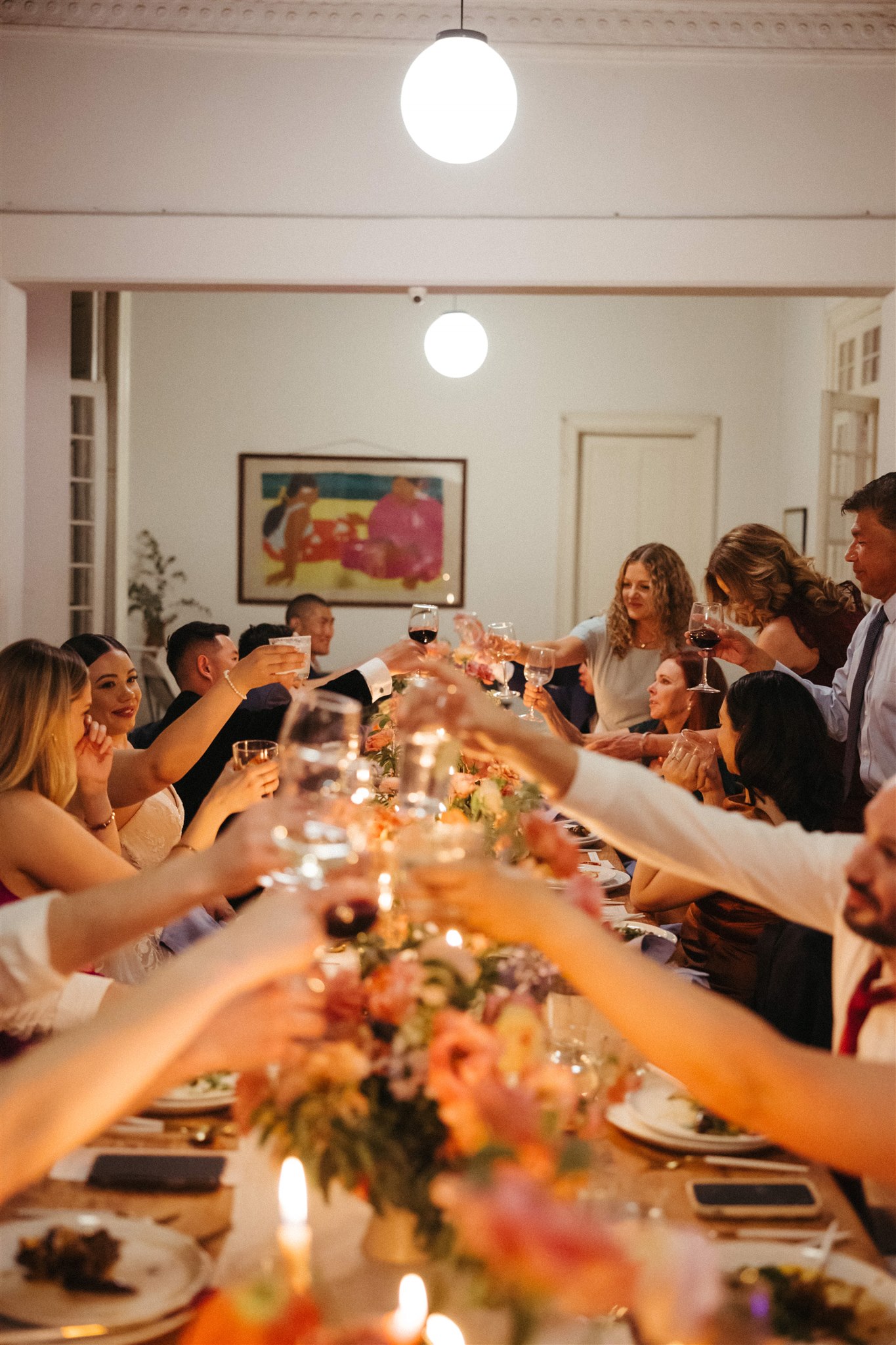 Long tablescape at Sobremesa with candles and lush florals