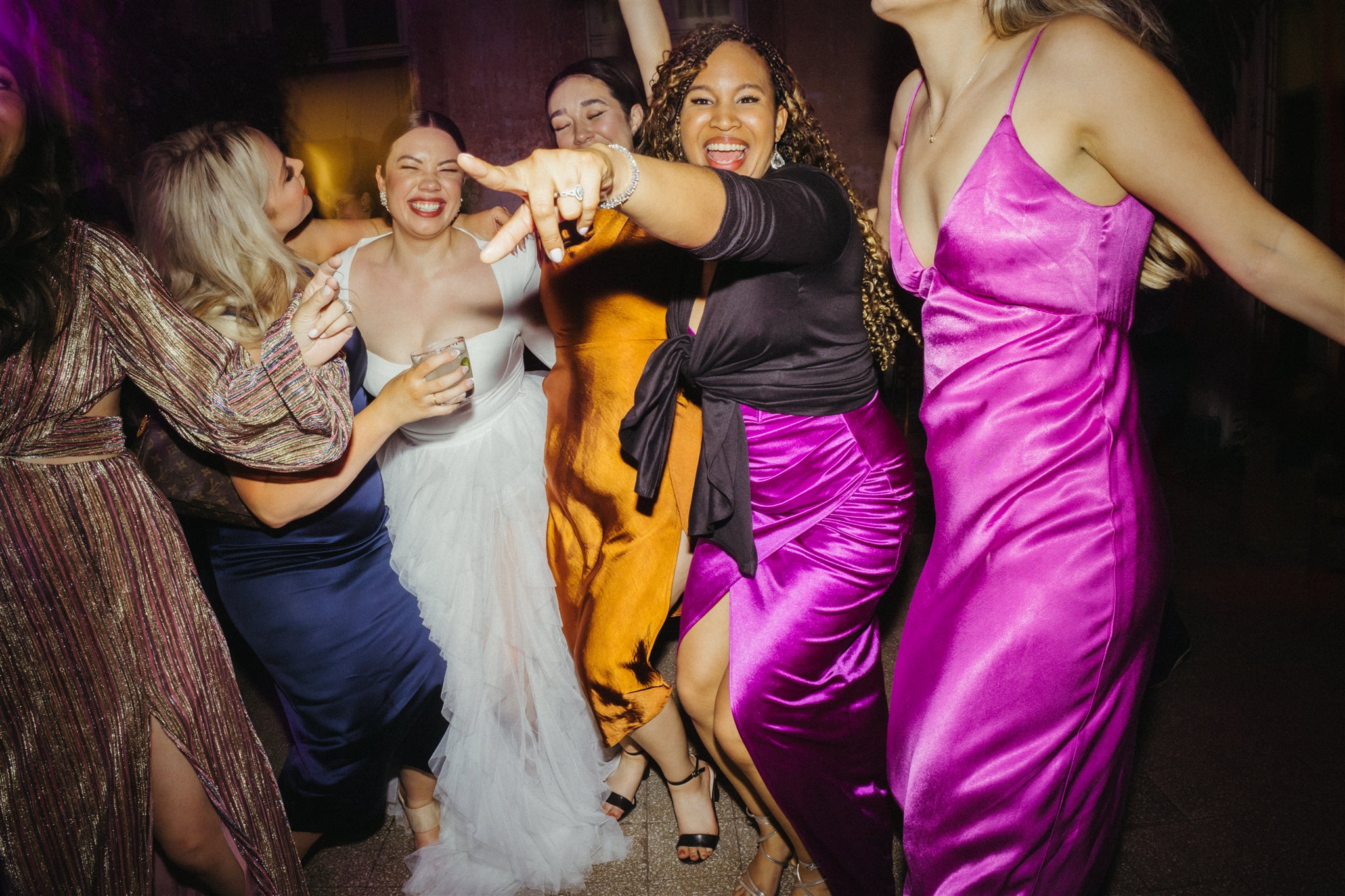 Flash-lit dance floor moment with joyful movement