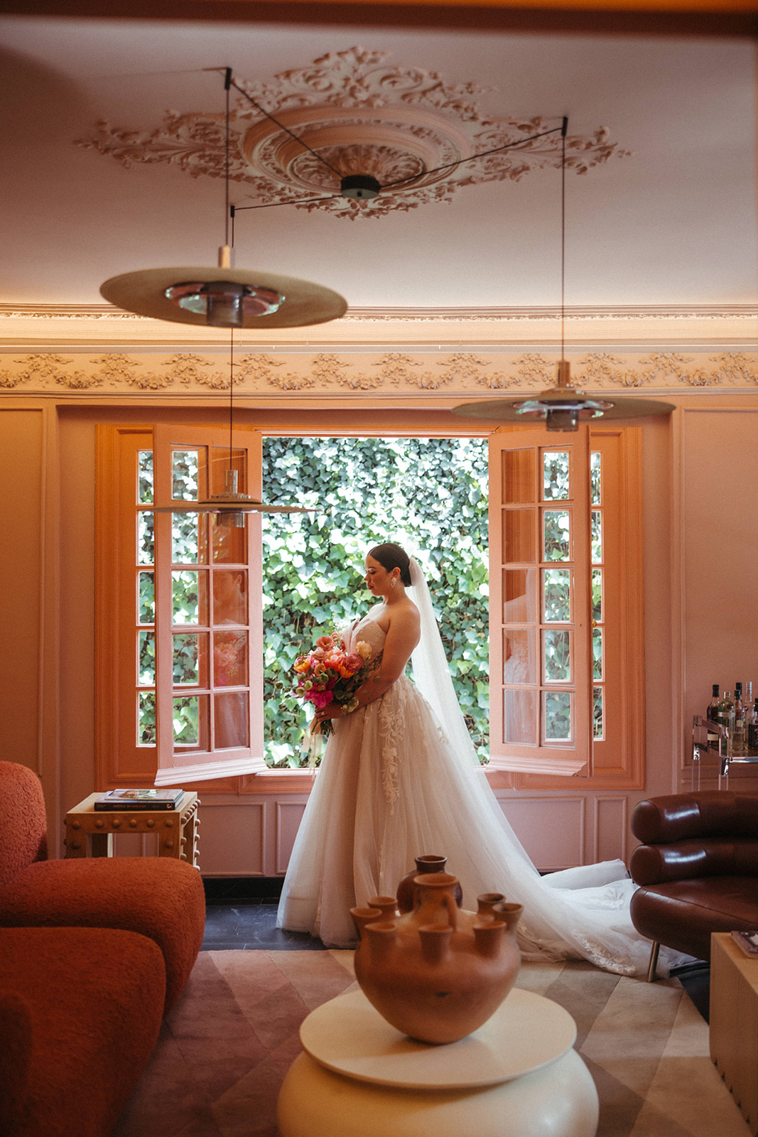 Bride getting ready at Ignacia Guest House in Mexico City with colorful designer interiors